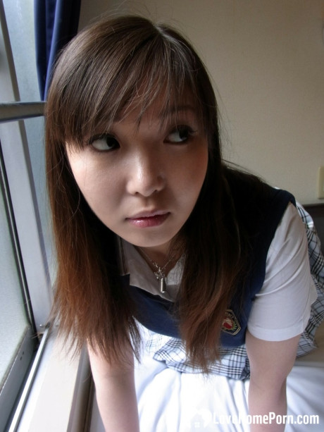 Lovely asian brunette babe unveiling her incredible humongous titties in a solo