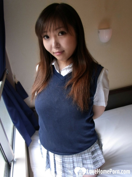 Lovely asian brunette babe unveiling her incredible humongous titties in a solo