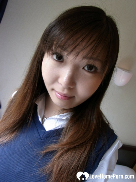 Lovely asian brunette babe unveiling her incredible humongous titties in a solo