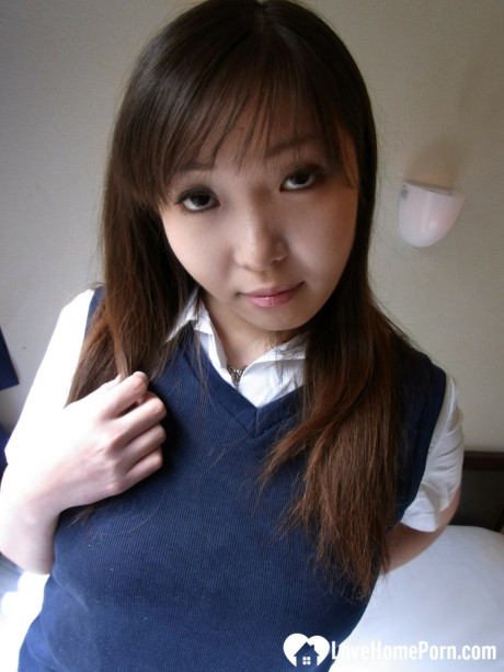 Lovely asian brunette babe unveiling her incredible humongous titties in a solo