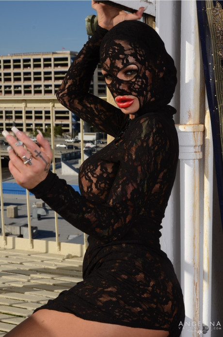 Curvy pornstar in a lacy dress Angelina Valentine reveals her huge boobs