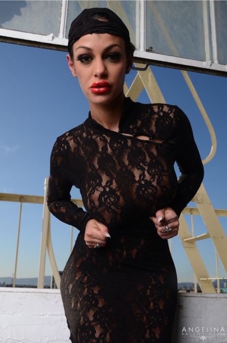 Curvy pornstar in a lacy dress Angelina Valentine reveals her huge boobs