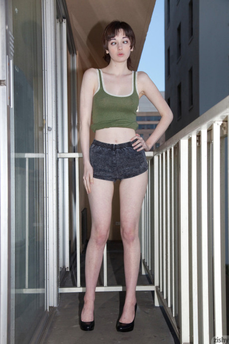 Sweet teenie bitch gf lady Lilly Gardner teases fully clothed on the balcony and sofa