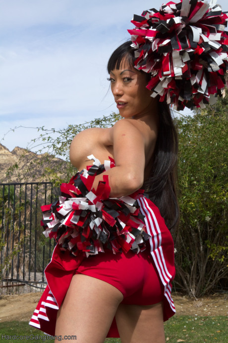 Oriental cheerleader with huge titties Gaia gets gangbanged by a group of strangers