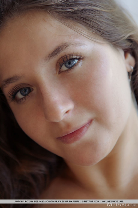 Gorgeous teenie Aurora Fox gets completely naked on a sofa during a solo show