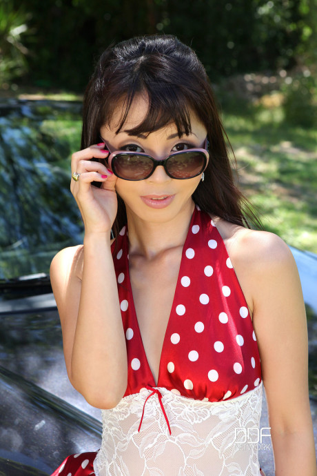 Skinny chinese old Marica Hase masturbates on a black Porsche outdoors