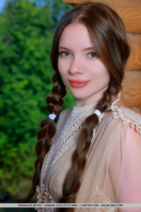Fresh young cutie Dariana gets naked with her long hair in braided pigtails