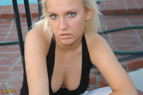 Blondy amateur Jordan smokes a cigarette while showing some cleavage