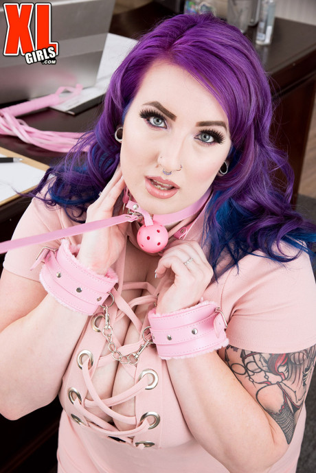 Hot BBW Lola Rayne with purple hair reveals mega pierced breasts at the office