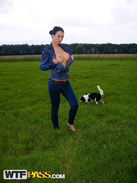 Dark haired chick girl chick Ella shows her firm boobs on a bed and in a field as well