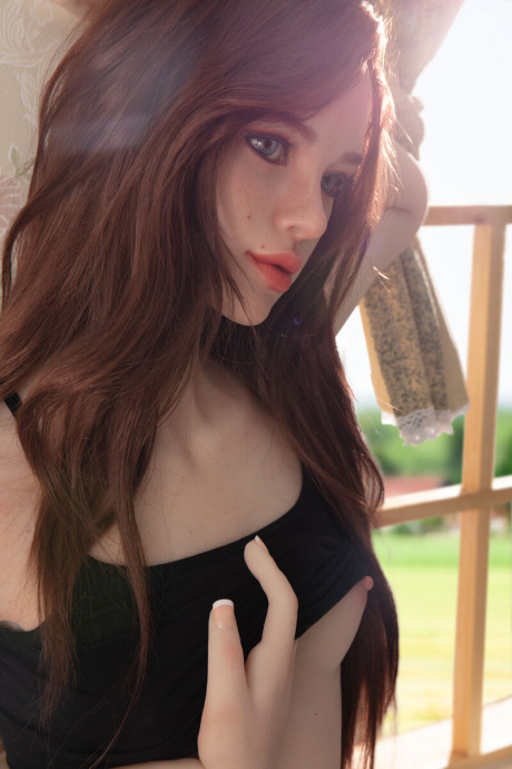 Pretty realistic sex doll shows off her flawless body in ebony undies