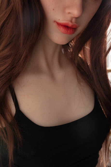Pretty realistic sex doll shows off her flawless body in ebony undies
