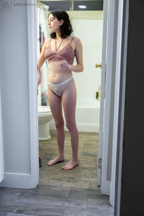 Nude brunette with natural bush Mary J caught getting dressed in the bathroom