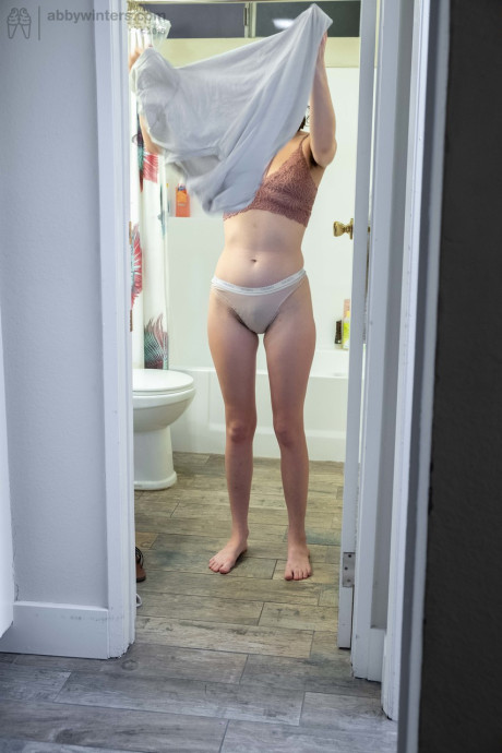 Nude brunette with natural bush Mary J caught getting dressed in the bathroom