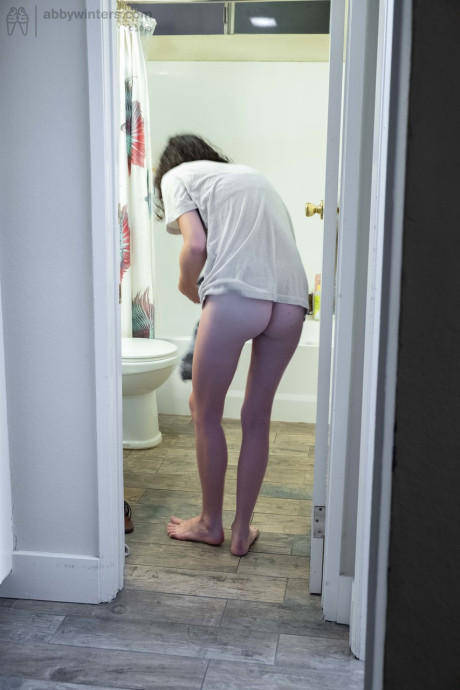 Nude brunette with natural bush Mary J caught getting dressed in the bathroom