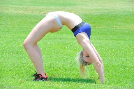 Delightful teenie jogger Summer reveals her attractive figure and poses in the park
