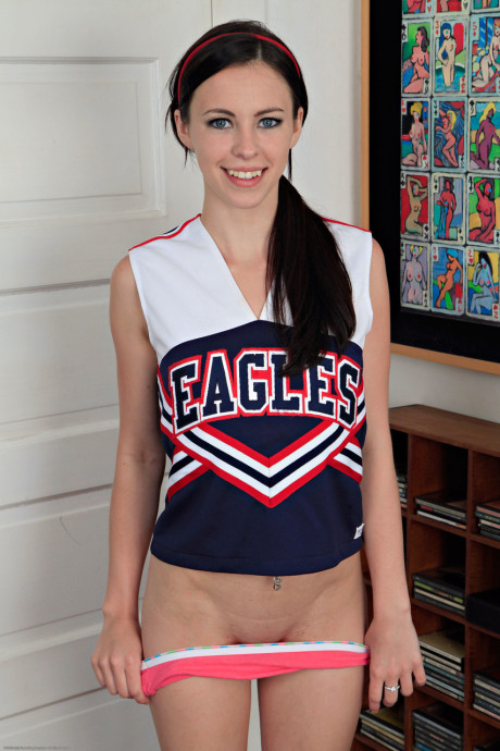 American cheerleader Veronica Radke undresses & slowly rubs her pretty snatch