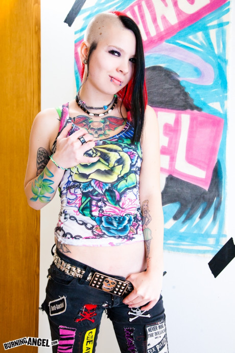 Emo punk skank lady rips her pants and panties to show her wet and craving pussy