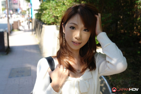 Japanese girl girlfriend broad Yuri Rie sucks on a schlong after being masturbated in a car