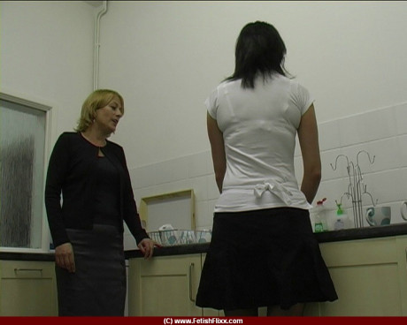 Dark-haired chick girl woman receives a brutal spanking and strapping in a kitchenette