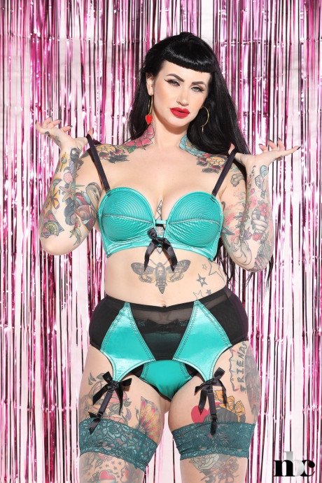 Voluptuous tattooed model Lucy Vixen shows her sweet curves in hot undergarment