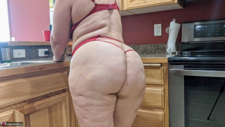 Amateur lady Busty Kris Ann shows her humongous boobs and ass in her cuisine