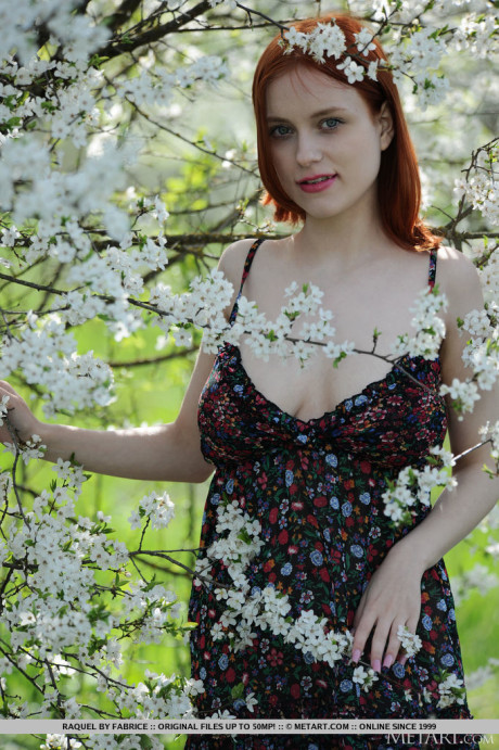 Pale ginger Raquel gets totally undressed underneath a flowering tree