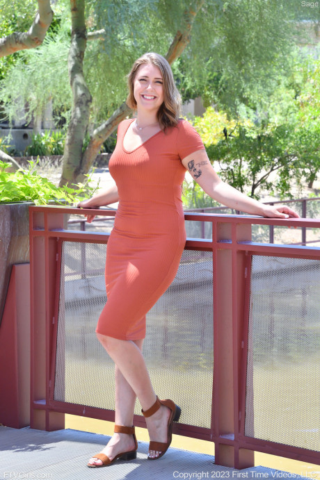 Glamorous brunette babe Sage flashing her panties and bra in public