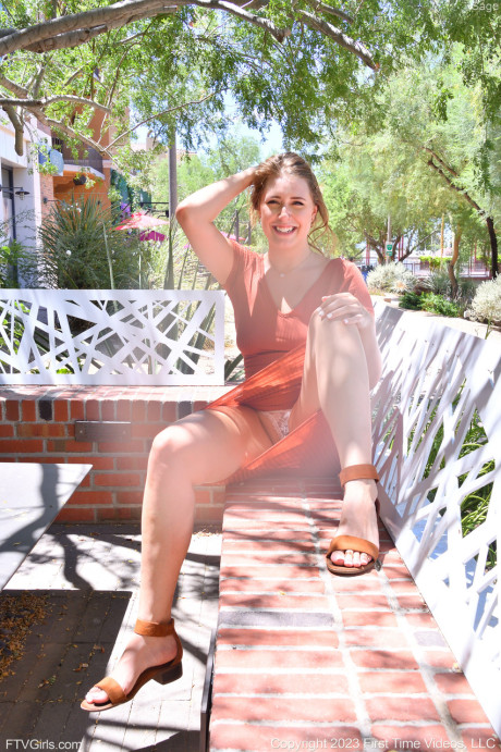 Glamorous brunette babe Sage flashing her panties and bra in public