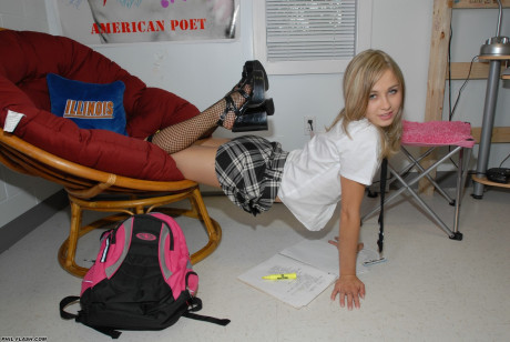 Fresh teen looking blond Kasia pulls down schoolgirl skirt in thong and nylon socks