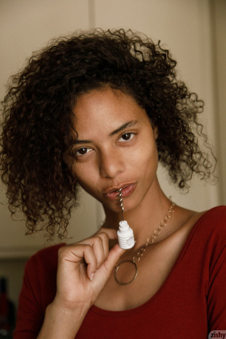 Skinny black Desiree Jacobsen shows her tiny boobs & bubble ass in a solo