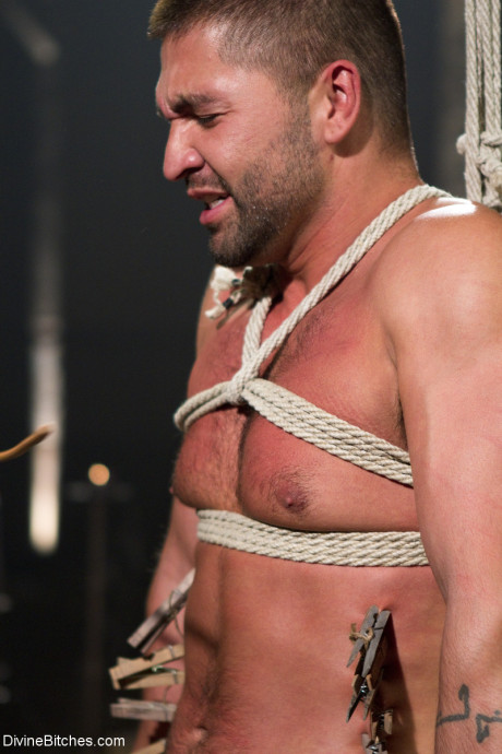 Fine domme in a latex outfit Beretta James torments a masked slave's dick