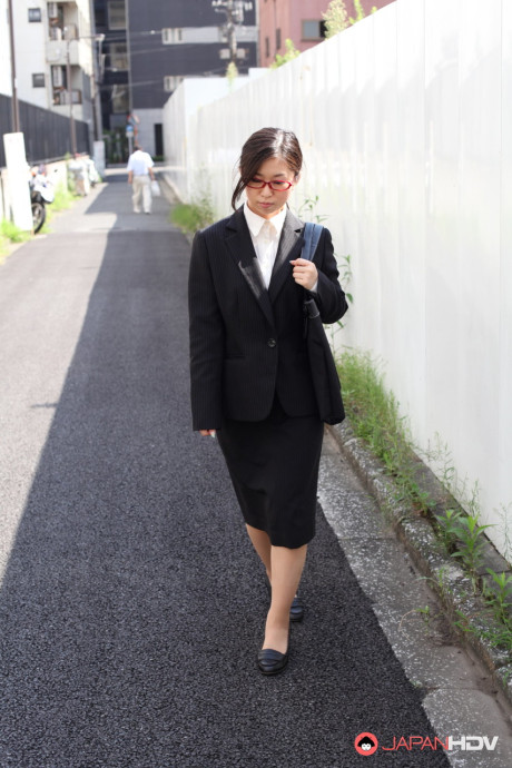 Japanese businesswoman Yuka Tsubasa gives an intense footjob & handjob