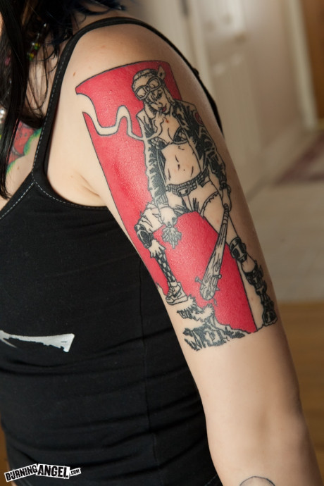 Dangerously hot babe Tara Toxic touches herself as she reveals her inked body