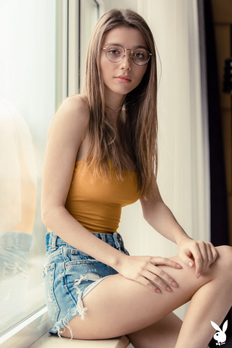 Alluring babe Mila Azul unveils her ravishing large tits in a sexy striptease