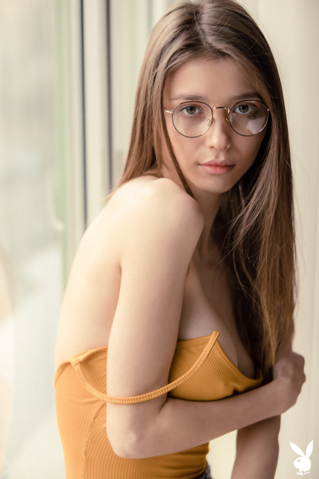 Alluring babe Mila Azul unveils her ravishing large tits in a sexy striptease
