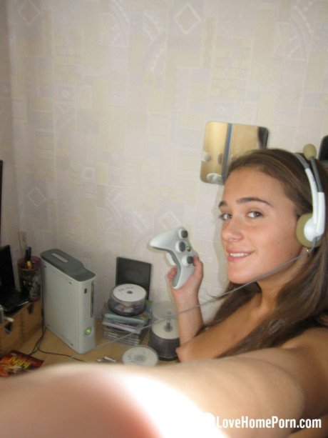 Hot gamer whore girl woman poses undressed and teases with her pretty boobs in a solo
