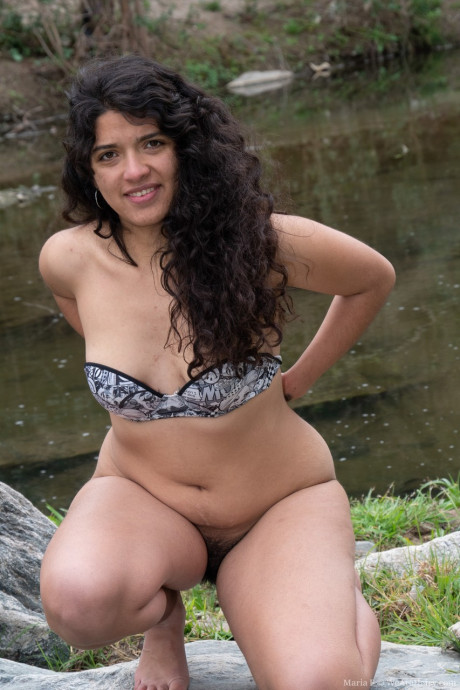 Brunette exotic teenie Maria F flaunts her silky beaver & natural breasts outdoors