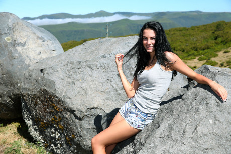 Dark haired chick GF girl finds herself in a field and needing to take a piss
