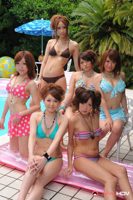 Pretty Japanese girlfriends in lovely swimsuits flaunt their beauty poolside