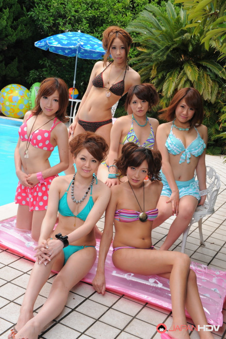 Pretty Japanese girlfriends in lovely swimsuits flaunt their beauty poolside