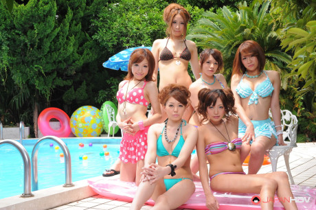 Pretty Japanese girlfriends in lovely swimsuits flaunt their beauty poolside