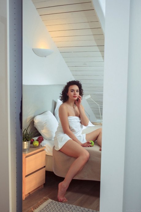 Curly haired teen Arcadia shows her incredible melons and pretty shaved clitoris