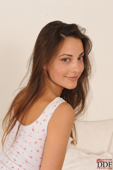 Sexy brunette babe Lorena doffs her bodysuit and flaunts her furry muff