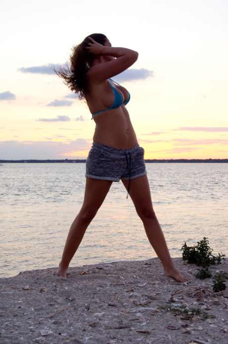 Stunning brunette model Jessica O shows her killer curves on the beach