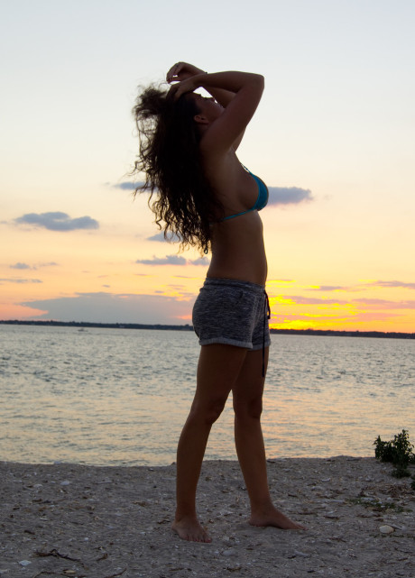 Stunning brunette model Jessica O shows her killer curves on the beach