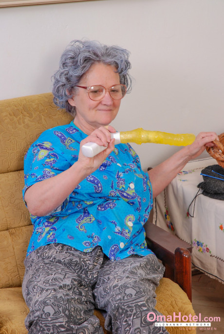 Large boobed young rides a curly haired granny with a yellow sex toy