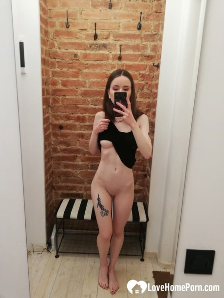 Short brunette takes selfies while stripping & posing sexily in the mirror