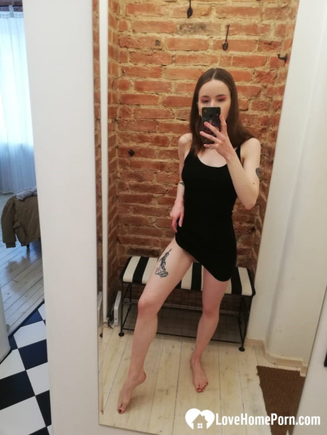 Short brunette takes selfies while stripping & posing sexily in the mirror