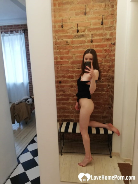 Short brunette takes selfies while stripping & posing sexily in the mirror